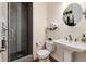 Modern bathroom features a glass-enclosed shower and updated fixtures at 1385 Birch St, Denver, CO 80220