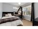 Bedroom featuring work-from-home station with large window and modern design elements at 1385 Birch St, Denver, CO 80220