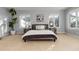 Light-filled bedroom featuring carpet flooring and large windows bringing the outside in at 1385 Birch St, Denver, CO 80220