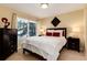 Bedroom featuring large window, carpet floors, neutral paint and contemporary furnishings at 1385 Birch St, Denver, CO 80220