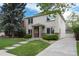 Charming two-story home with well-maintained lawn and landscaped yard, plus driveway at 1385 Birch St, Denver, CO 80220