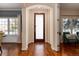 Inviting foyer with hardwood floors and a stylish frosted-glass front door at 1385 Birch St, Denver, CO 80220