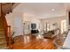 Bright and open living room with hardwood floors, stairs, and large windows for natural light at 1385 Birch St, Denver, CO 80220
