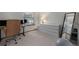 Bedroom with carpeted floors, white walls, work desk, large dresser, and window view at 1919 Newland Ct, Lakewood, CO 80214