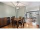 Cozy dining room with stylish light fixture, dining table, and hardwood flooring at 1919 Newland Ct, Lakewood, CO 80214