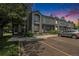 Attractive townhome featuring a gray exterior, front parking, and well-maintained landscaping at 1919 Newland Ct, Lakewood, CO 80214