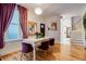 Bright dining room featuring a decorative table and hardwood floors at 2431 N Ogden St, Denver, CO 80205