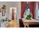 Bright dining room featuring a decorative table and hardwood floors and access to other rooms at 2431 N Ogden St, Denver, CO 80205