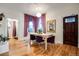 Charming dining room features hardwood floors and a decorative light fixture at 2431 N Ogden St, Denver, CO 80205