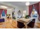 Open dining room featuring a decorative table and hardwood floors at 2431 N Ogden St, Denver, CO 80205