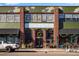 Denver Central Market's brick building with an artistic facade and greenery at 2431 N Ogden St, Denver, CO 80205