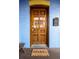 Ornate wood front door with glass panels and welcoming mat at 2431 N Ogden St, Denver, CO 80205