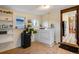 Functional laundry room with washer, dryer, shelving and access to other rooms at 2431 N Ogden St, Denver, CO 80205