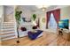 Cozy living room featuring a comfortable sofa and hardwood floors at 2431 N Ogden St, Denver, CO 80205