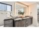 Bathroom featuring double sink vanity with stone countertop, modern lighting, and contemporary style at 1717 Irving St, Denver, CO 80204
