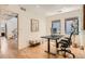 Well-lit home office with a modern desk, comfortable seating, and views from the windows, enhancing productivity at 1717 Irving St, Denver, CO 80204