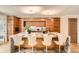 Modern kitchen island with marble countertop and wooden cabinets, highlighted by unique lighting fixtures at 1717 Irving St, Denver, CO 80204