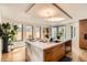 Bright kitchen featuring a large marble island with a sink, custom cabinetry, and modern lighting at 1717 Irving St, Denver, CO 80204