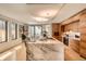 Elegant kitchen boasting a marble island with seating, custom cabinets, and modern stainless steel appliances at 1717 Irving St, Denver, CO 80204