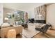 Bright living room with a marble fireplace, hardwood floors, a large window, and stylish furniture at 1717 Irving St, Denver, CO 80204