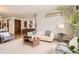 Well-lit living room with hardwood floors, neutral tones, modern furniture and tasteful decor at 1717 Irving St, Denver, CO 80204