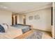 Minimalist main bedroom with a neutral color scheme, large window, and modern decor, offering a calm retreat at 1717 Irving St, Denver, CO 80204