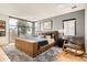 Serene main bedroom features a large window, plush rug, and stylish furnishings, creating a relaxing atmosphere at 1717 Irving St, Denver, CO 80204