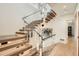 Modern staircase with wood treads, glass railing, stainless steel handrail and unique pendant lights at 1717 Irving St, Denver, CO 80204