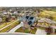 Aerial view of a home with solar panels, a playset in the backyard, and a manicured lawn at 13686 Dexter St, Thornton, CO 80602