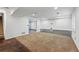 Spacious basement with carpet, door to another room, and good lighting at 13686 Dexter St, Thornton, CO 80602