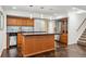 Finished basement with kitchenette and stairway access to main floor at 13686 Dexter St, Thornton, CO 80602
