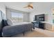 Cozy bedroom offers a peaceful retreat with a fireplace and television for relaxing evenings at 13686 Dexter St, Thornton, CO 80602