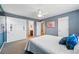 Comfortable bedroom with en-suite bathroom access, closet, and bright decor create a relaxing atmosphere at 13686 Dexter St, Thornton, CO 80602