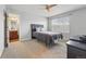 Comfortable bedroom featuring en-suite bathroom access and bright window at 13686 Dexter St, Thornton, CO 80602