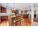 Spacious dining area adjacent to the kitchen, with hardwood floors and modern finishes at 13686 Dexter St, Thornton, CO 80602