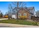 Beautiful single-Gathering home features a well-maintained lawn, flowering shrubs, and mature trees at 13686 Dexter St, Thornton, CO 80602