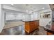 Kitchen island with seating and storage, in partially finished basement at 13686 Dexter St, Thornton, CO 80602