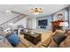Bright living room features a fireplace, large TV, and stylish decor for a relaxing atmosphere at 13686 Dexter St, Thornton, CO 80602