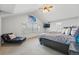 Spacious main bedroom with vaulted ceiling, plush carpeting, large windows, a TV, and stylish decor at 13686 Dexter St, Thornton, CO 80602