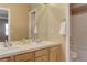 Bathroom featuring double sinks and a tub and shower combination at 10169 Briargrove Way, Highlands Ranch, CO 80126