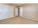 Bedroom featuring a double closet and neutral carpet at 10169 Briargrove Way, Highlands Ranch, CO 80126