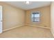 Cozy bedroom with neutral carpet and a window providing natural light at 10169 Briargrove Way, Highlands Ranch, CO 80126