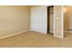 Bedroom featuring sliding closet doors and neutral carpet at 10169 Briargrove Way, Highlands Ranch, CO 80126