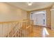 Welcoming foyer with hardwood floors, a staircase, and bright double doors at 10169 Briargrove Way, Highlands Ranch, CO 80126