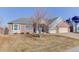 Well-maintained home boasts brick accents, a bay window, and a two-car garage at 10169 Briargrove Way, Highlands Ranch, CO 80126