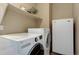 Convenient laundry room includes front loading washer and dryer at 10169 Briargrove Way, Highlands Ranch, CO 80126
