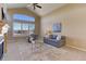 The living room features vaulted ceilings, and a large window that fills the space with natural light at 10169 Briargrove Way, Highlands Ranch, CO 80126