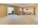 Spacious living room featuring a sliding glass door for outside access at 10169 Briargrove Way, Highlands Ranch, CO 80126