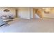Open-concept living room and staircase with neutral decor at 10169 Briargrove Way, Highlands Ranch, CO 80126