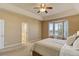 Bright bedroom with large windows and en-suite bathroom at 10169 Briargrove Way, Highlands Ranch, CO 80126